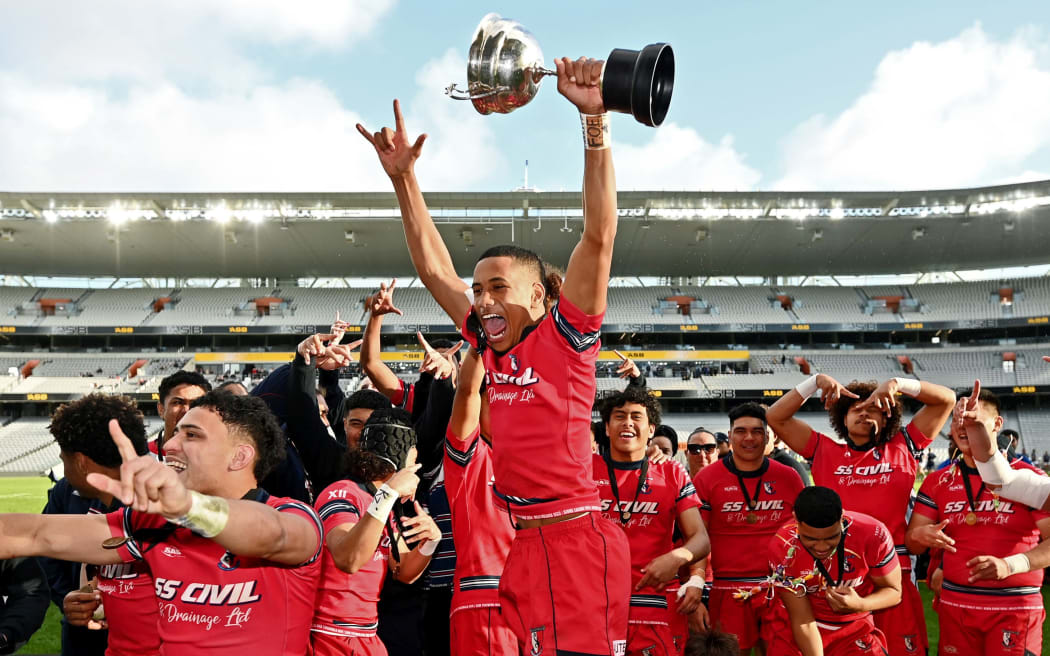 Kelston BHS players celebrate winning the Auckland 1st XV rugby final at Eden Park in August.