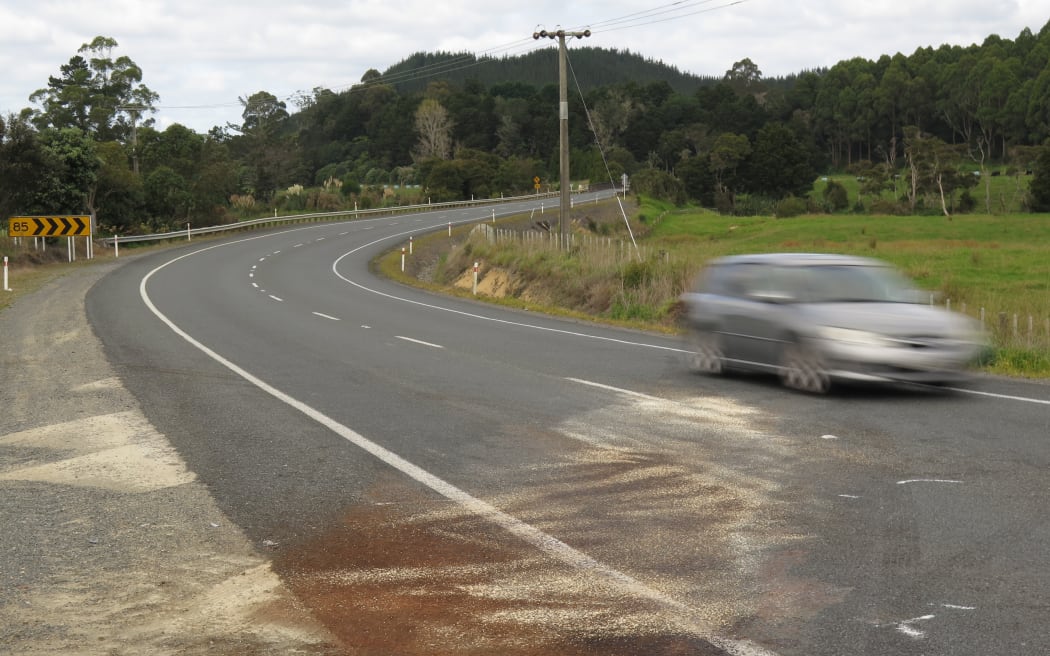 Oil and absorbent grit spread by firefighters mark the spot where a station wagon and a van collided in April 2018 at the bottom of Bulls Gorge, on SH10 near Kerikeri, with fatal consequences.