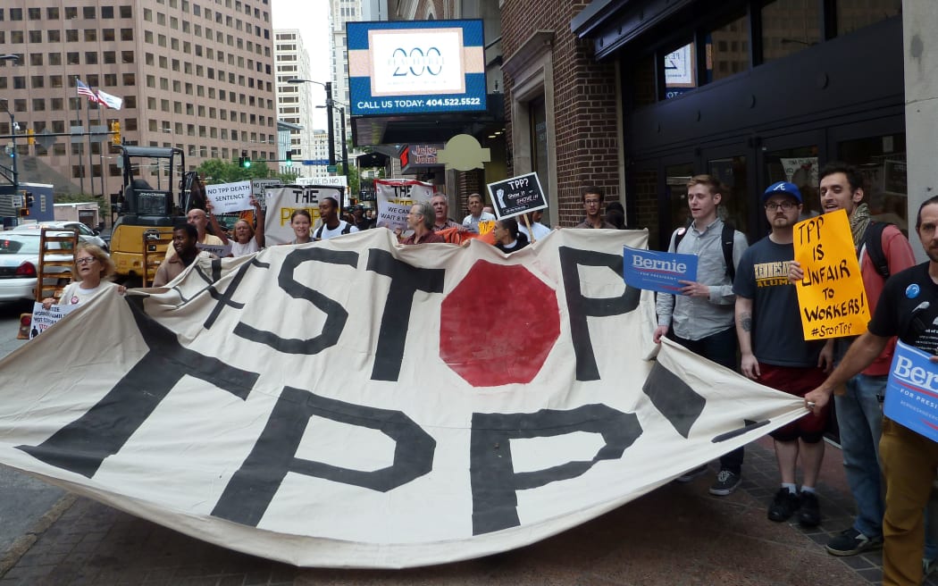 Protesters call for the rejection of the Trans-Pacific Partnership trade deal under negotiation in Atlanta, Georgia.