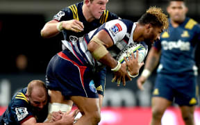 Rebels loose forward Amanaki Mafi carries the ball against the Highlanders.