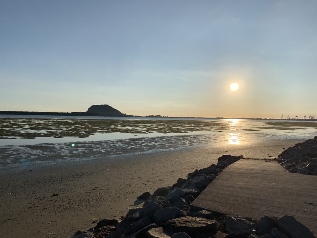 Mauao - to mean 'caught by the light' stems from the local story of the once nameless mountain.