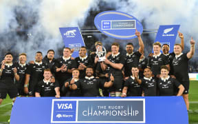 All Blacks players celebrate after beating Argentina.