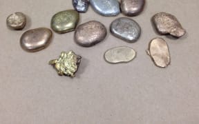 The police said dawn raids in Whangarei turned up $6500 worth of gold that had been melted down.