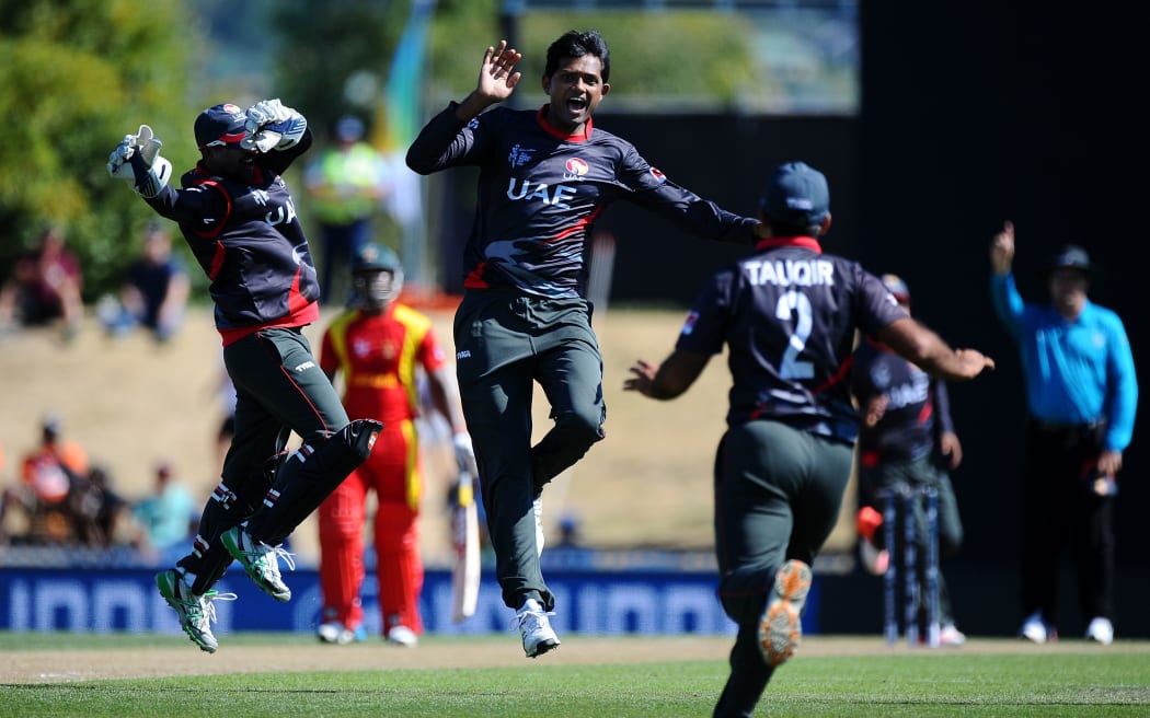 UAE bowler Amjad Javed celebrates the wicket of Hamilton Masakadza in Nelson