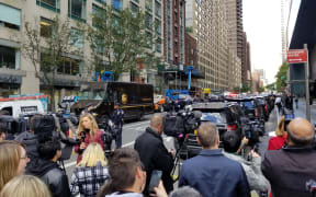 Police officers take security measures in front of the Time Warner Building where a suspected explosive device was found in the building after it was delivered to CNN's New York bureau in New York.