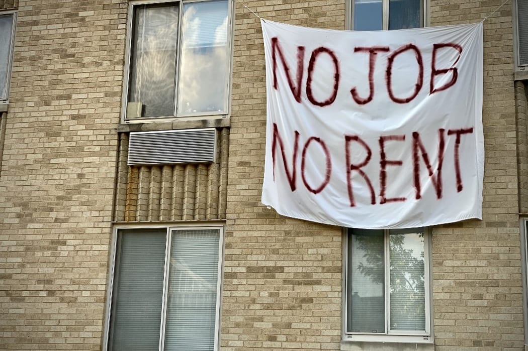 A banner against renters eviction reading no job, no rent is displayed on a controlled rent building in Washington, DC on August 9, 2020. -