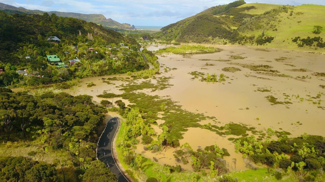 Residents of Te Henga Bethells Beach have no access to the only road out of the area after flooding in the area.