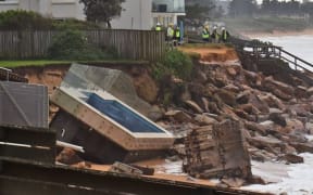 An inground pool sits amongst the rocks after a severe storm at Collaroy on Sydney's northern beaches.