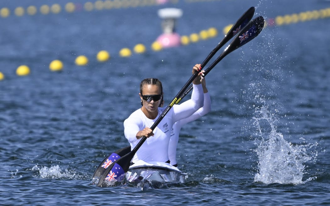 New Zealand's Lisa Carrington (FRONT) and New Zealand's Alicia Hoskin in the women's kayak double 500m heats canoe sprint competition at Vaires-sur-Marne Nautical Stadium in Vaires-sur-Marne during the Paris 2024 Olympic Games on August 6, 2024. (Photo by Olivier MORIN / AFP)