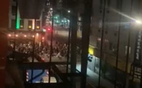 Images from a video showing protesters marching in support of the Black Lives Matter movement, calling for an end to racial injustice.