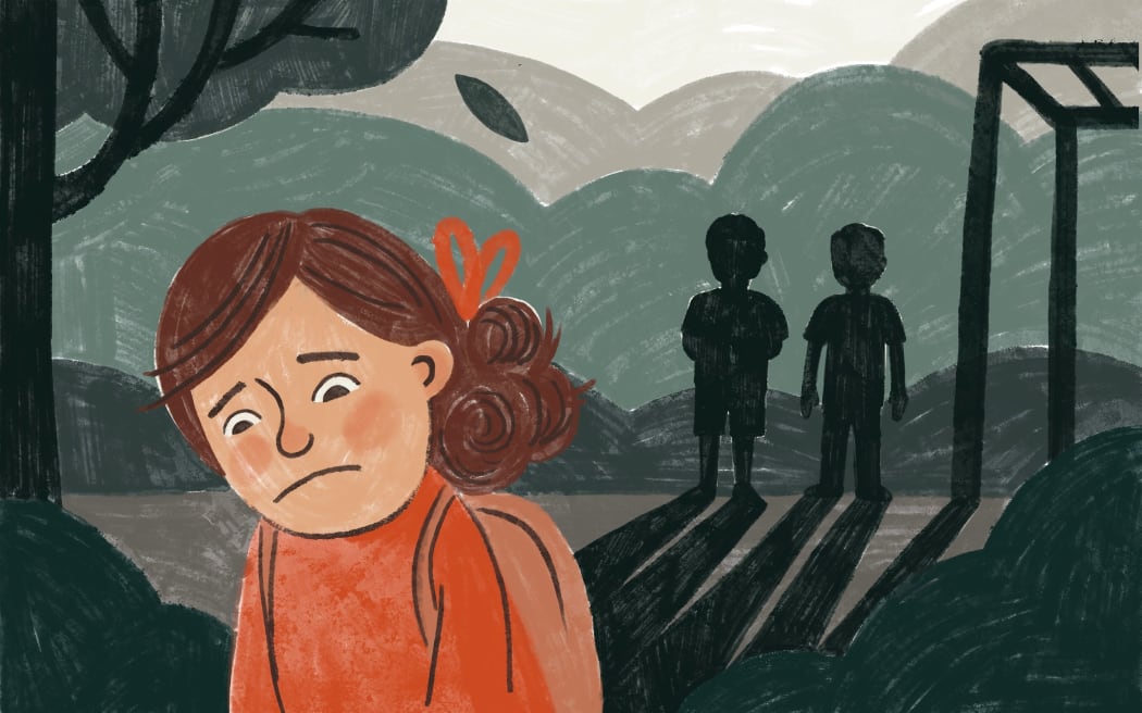 Young girl with sad and withdrawn expression walking away from two bullies