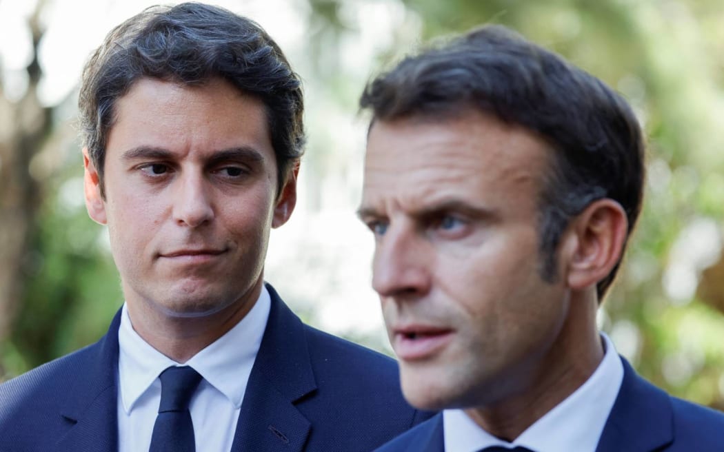 Gabriel Attal with Emmanuel Macron. (Photo by Ludovic MARIN / POOL / AFP)