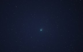 Comet C/2022 E3 (ZTF) is visible in the sky above the Mojave National Preserve in San Bernadino County as it approaches Earth for the first time in about 50,000 years on January 31, 2023 near Baker, California.