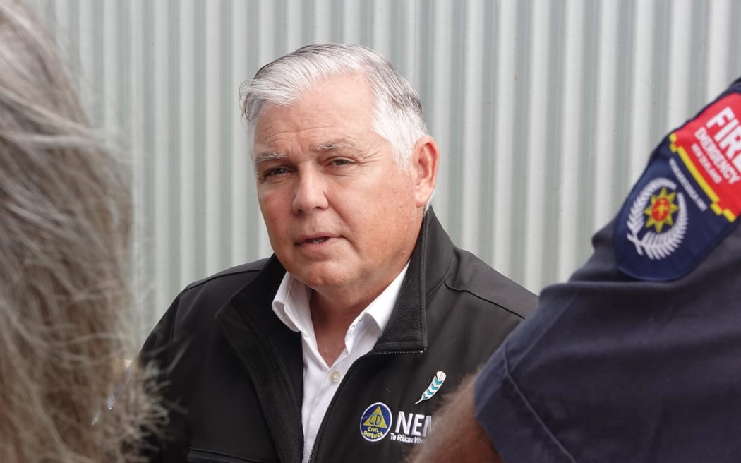 Emergency Management Minister Mark Mitchell talks to emergency responders in Mangawhai.