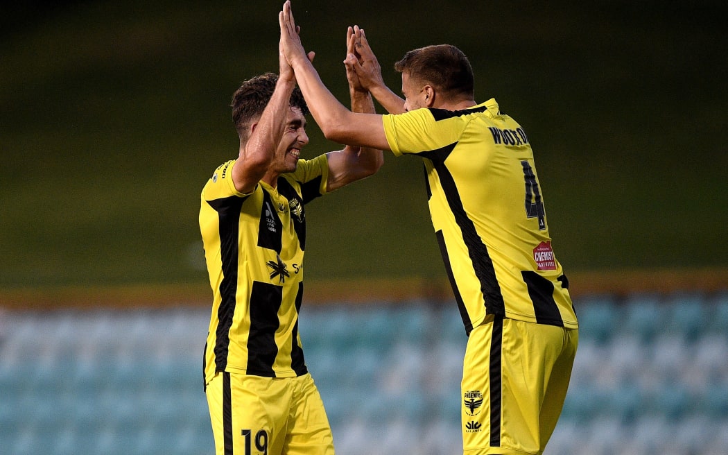 Sam Sutton (left) and Scott Wootton celebrate a win over Perth Glory in 2022.
