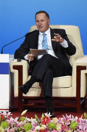John Key speaking during the APEC CEO Summit in Beijing.