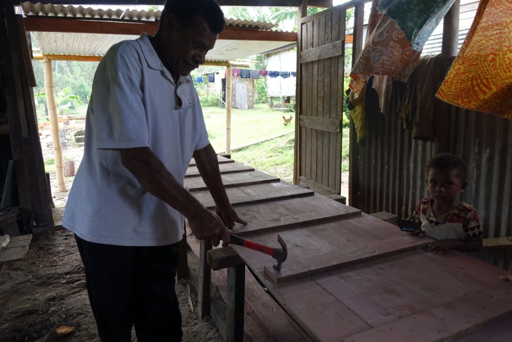 Nawaisomo village chief Ratu Waisea Drakusiwale is building a new river boat. His last one was washed away in floods