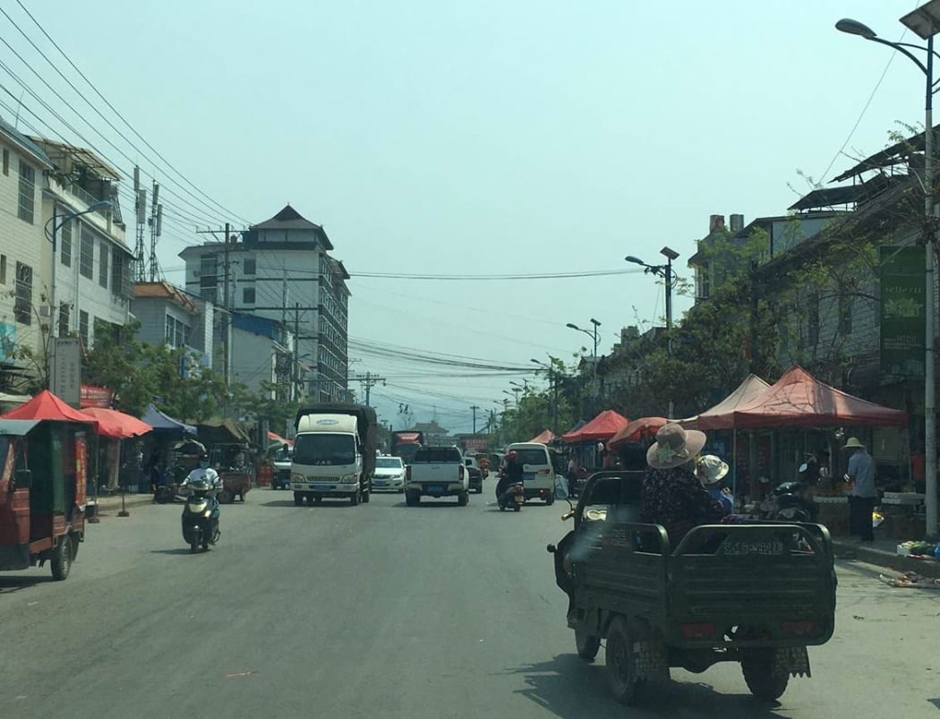A shot of a village near Yunnan, China, where people are starting to come out after lockdown.