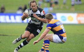 Andrew Horrell of Hawke's Bay is lined up by Bay of Plenty's Nick Evemy.