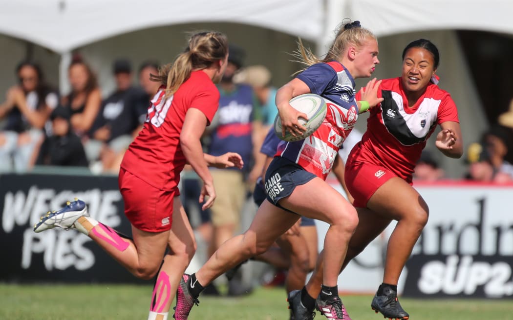 Christchurch Girls High School player Jorja Miller runs in tries while playing Howick College during the rugby national rugby  girls final.