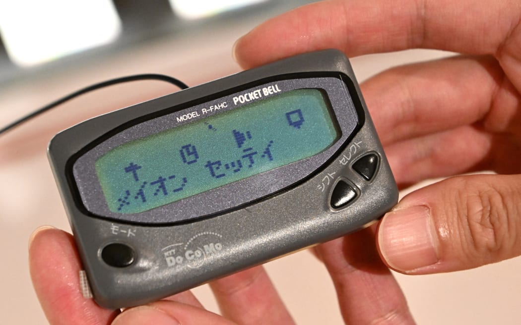 A pager is displayed at a facility operated by NTT DOCOMO, INC. Japan's telecommunications company, which provides mobile services, in Tokyo on Oct. 20, 2022. ( The Yomiuri Shimbun ) (Photo by Hidenori Nagai / Yomiuri / The Yomiuri Shimbun via AFP)