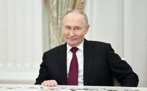 In this pool photograph distributed by the Russian state agency Sputnik, Russia's President Vladimir Putin attends a meeting with US special envoy Steve Witkoff and US President Donald Trump's son-in-law Jared Kushner (both not pictured) at the Kremlin in Moscow on December 2, 2025. (Photo by Alexander KAZAKOV / POOL / AFP)