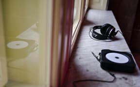 Headphones are lying on the windowsill at the House of Sound in Lviv, Ukraine, on December 16, 2023. The House of Sound is a special space where the employees of Lviv Radio are working with various types of sound and music. Additionally, they are holding educational projects, audio performances, and sound plays there. NO USE RUSSIA. NO USE BELARUS. (Photo by Ukrinform/NurPhoto) (Photo by Anastasiia Smolienko / NurPhoto / NurPhoto via AFP)