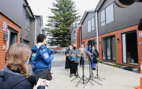 Pacific Peoples Minister Aupito William Sio speaks to media at homes for families coming out of quarantine.