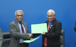 New Caledonia president Louis Mapou and Vanuatu prime minister Bob Loughman exchanging a memorandum of understanding which paves the way for a second submarine cable installment in New Caledonia.