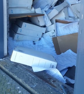 Council documents at the damaged building.