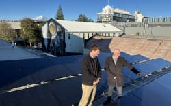 New Plymouth council’s Mat Sycamore and Greg Stephens check out new solar panels on the TSB Showplace.
