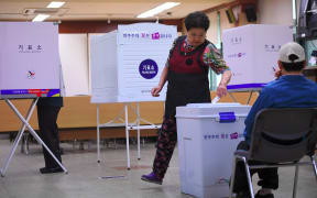 South Koreans cast their votes in the presidential election at a polling station in Seoul.