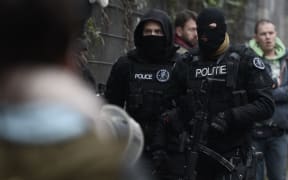 Armed policemen near the scene in Molenbeek-Saint-Jean, Brussels, where Salah Abdeslam was apparently wounded and captured.