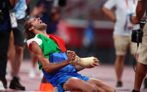 Gianmarco Tamberi wins a gold in the high jump.