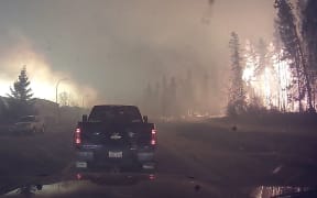 A dashcam video of residents evacuating the Canadian city of Fort McMurray Fire  during a massive forest fire.