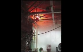 A screenshot from a video showing the battle against the fire from inside the building.