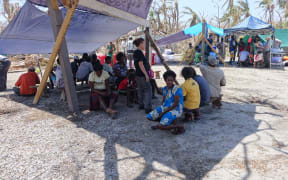 Medical need - Mataso village residents queue up to be assessed.