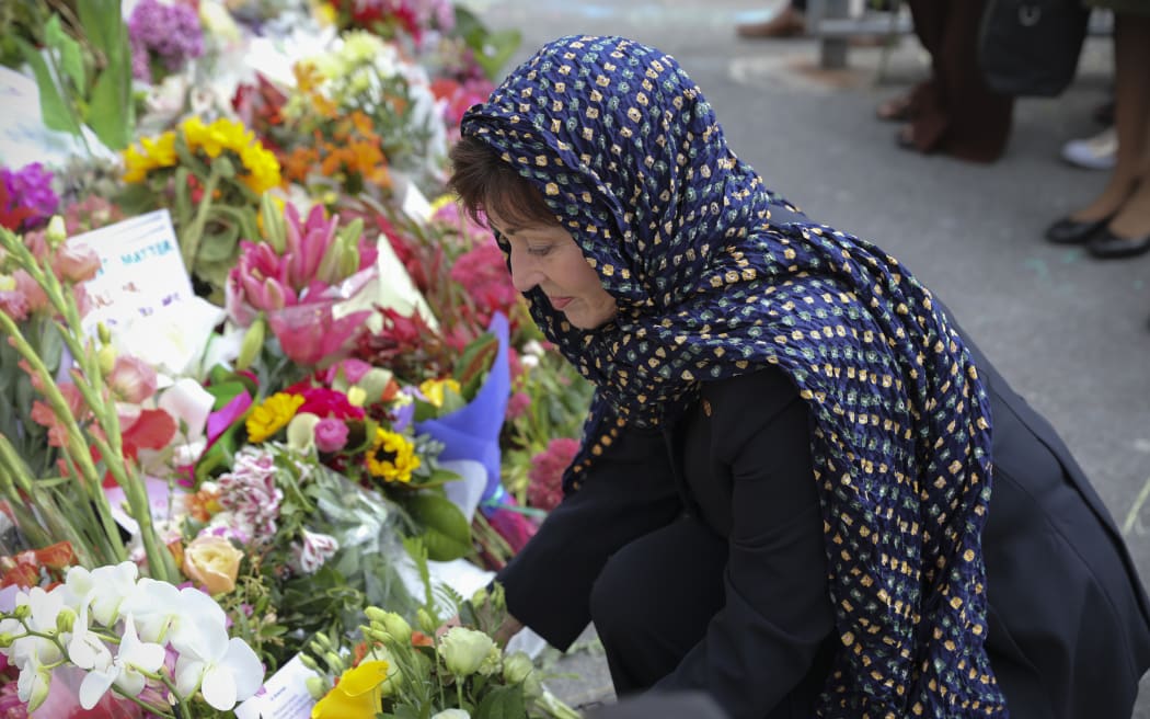 The Governor-Genreral Dame Patsy Reddy places flowers at the Wellington Islamic Centre in Kilbirnie