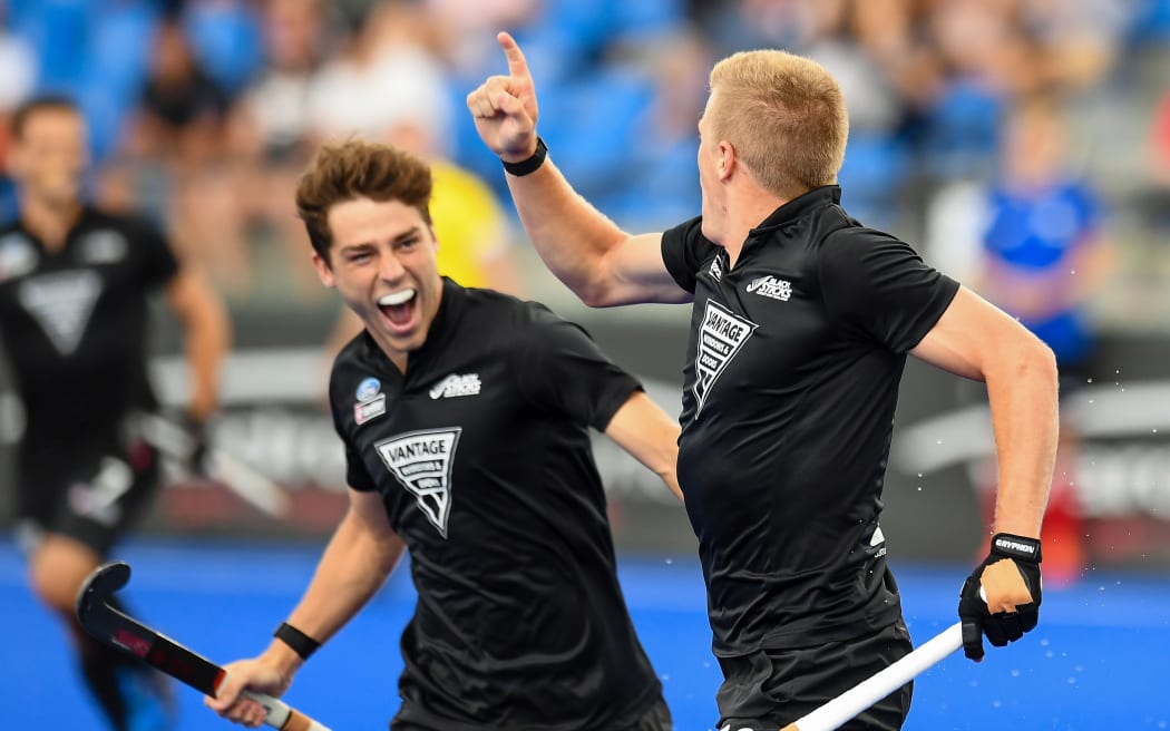 Sam Lane of the Black Sticks celebrates his goal with Aidan Sarikaya of the Black Sticks during the FIH Pro League of Hockey.