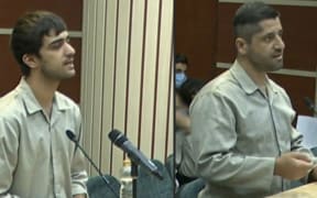 An image grab of footage obtained from Iranian State TV IRINN on 7 January 2023 shows Mohammad Mahdi Karami and Seyyed Mohammad Hosseini, who were executed for killing a member of Iran's Basij paramilitary force amid protests, attending a court hearing in Karaj on December 5. - The latest hangings double the number of executions to four over the nationwide protests, which escalated since mid-September into calls for an end to Iran's clerical regime.