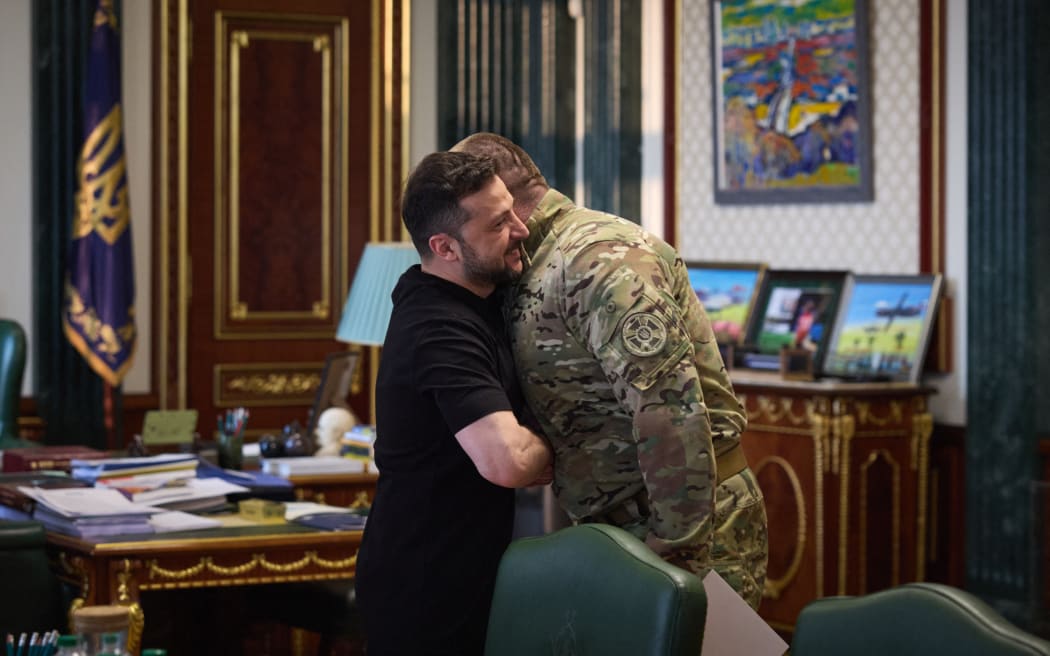 This handout photograph taken and released by the Ukrainian Presidential Press Service on June 1, 2025 shows Ukrainian President Volodymyr Zelensky (L) greeting the head of Ukraine’s Security Service Vasyl Malyuk (R) in Kyiv, amid the Russian invasion of Ukraine. Ukraine said on June 1, 2025 it launched a "large-scale" attack against Russian military aircraft on the same day, hitting a base in eastern Siberia thousands of kilometres (miles) from its border, a source within the Ukrainian security services said. (Photo by Handout / UKRAINIAN PRESIDENTIAL PRESS SERVICE / AFP) / RESTRICTED TO EDITORIAL USE - MANDATORY CREDIT "AFP PHOTO / UKRAINIAN PRESIDENTIAL PRESS SERVICE" - NO MARKETING NO ADVERTISING CAMPAIGNS - DISTRIBUTED AS A SERVICE TO CLIENTS