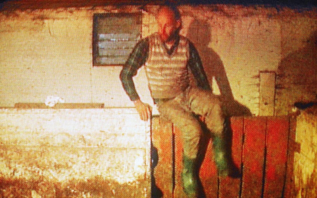 This frame grab from an undated Global Television broadcast shows pig farmer Robert William Pickton inside a barn on his pig farm in Port Coquitlam, Canada. Pickton has been charged with numerous counts of first degree murder relating to the disappearance of more than 60 women from the downtrodden eastside of downtown Vancouver. His preliminary hearing was held 13 January in Port Coquitlam. AFP PHOTO/GLOBAL TELEVISION  ALL CANADIAN TELEVISION STATIONS OUT (Photo by GLOBAL TELEVISION / AFP)