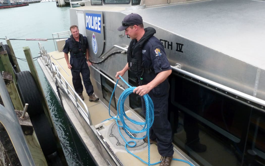 Senior Sergeant David Houston, left, and Constable Kyle Smith prepare to leave the berth.