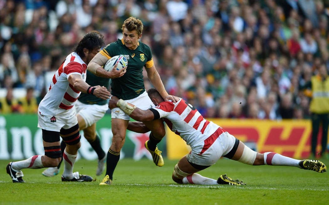 Patrick Lambie is tackled in South Africa's World Cup loss to Japan.