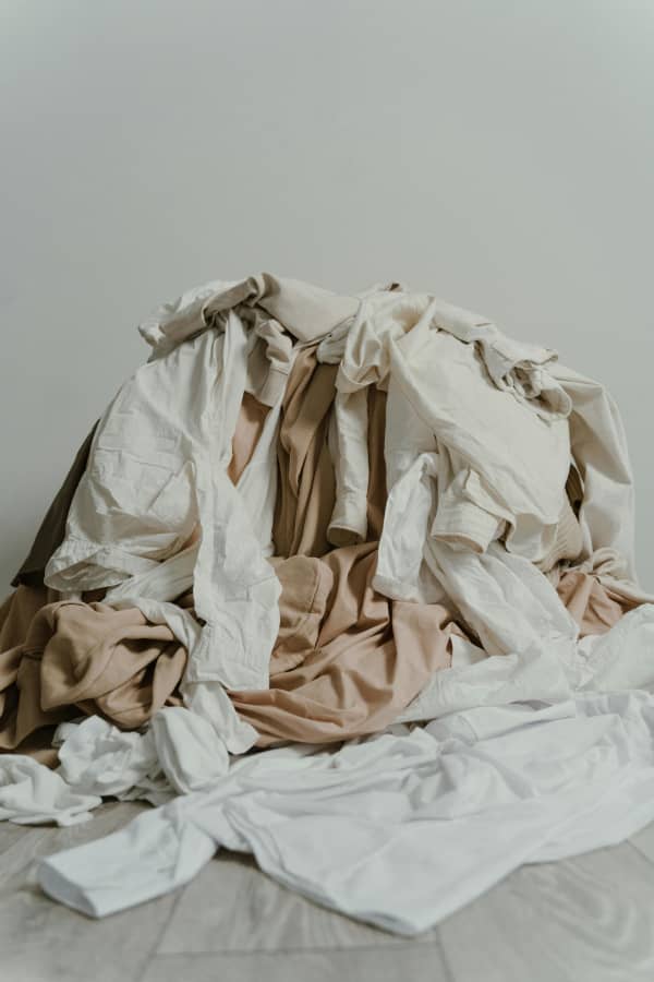 A pile of white and light brown laundry items.