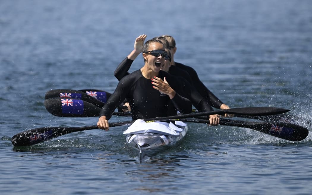 New Zealand's gold medallists Lisa Carrington, Alicia Hoskin, Olivia Brett and Tara Vaughan celebrate their victory in the women's kayak four 500m final of the canoe sprint competition at Vaires-sur-Marne Nautical Stadium in Vaires-sur-Marne during the Paris 2024 Olympic Games on August 8, 2024. (Photo by Olivier MORIN / AFP)