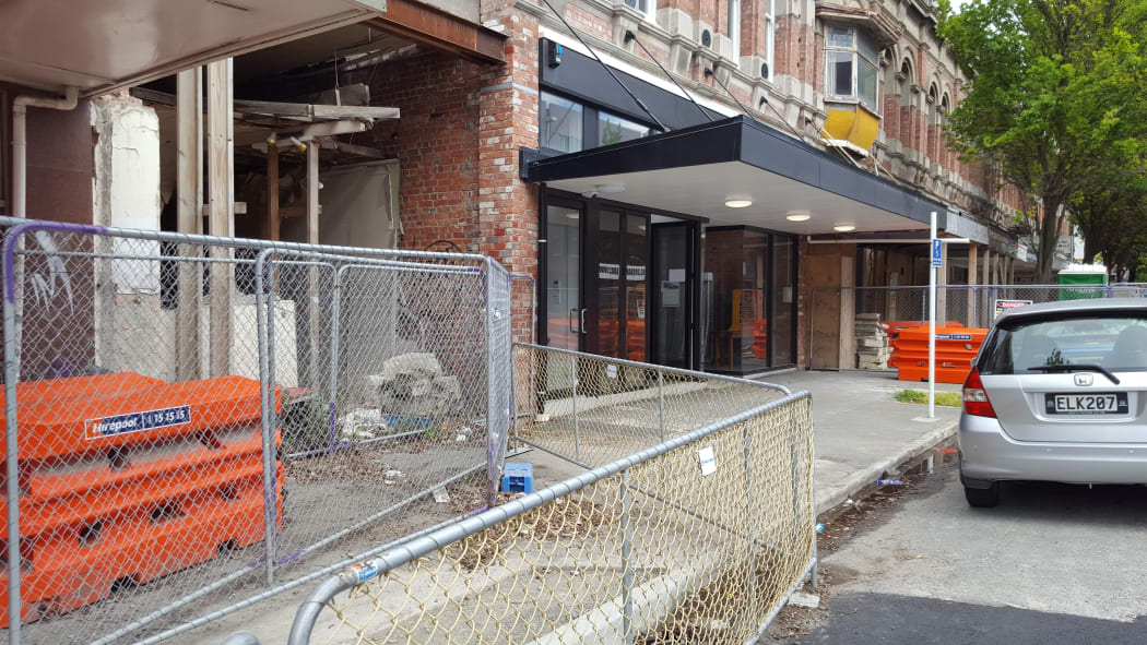 The Arts family business is surrounded on both sides by earthquake damaged buildings.
