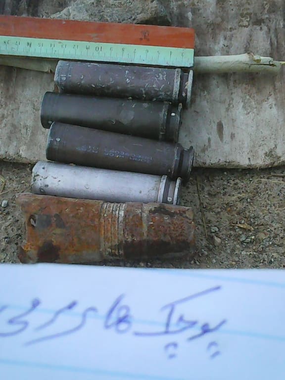 Empty shell casings - which the authors said were Apache helicopter high explosive cannon rounds, found scattered throughout the villages.