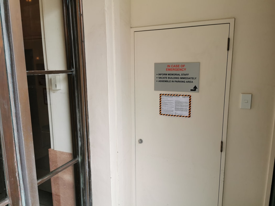 An earthquake-prone building notice inside the Carillon.