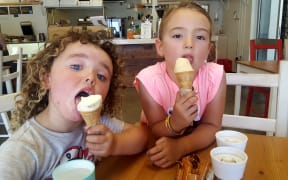 Four-year-old Mac Stephens of Nelson (left) and Tazmin Emsley, 6, also of Nelson, cool off with gelato in a Nelson café.